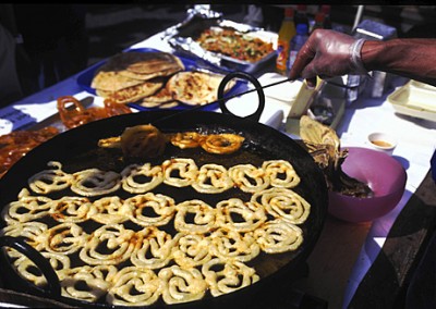 Street kitchen, bangladesh. Dhaka. Food stall selling fried phokaras