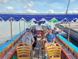 Riding traditional shallow engine boat in Barishal